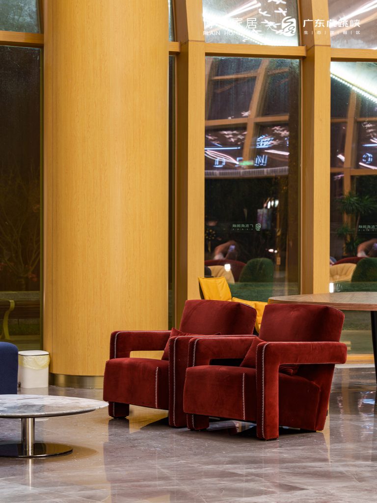 red armchairs at the corner of art space